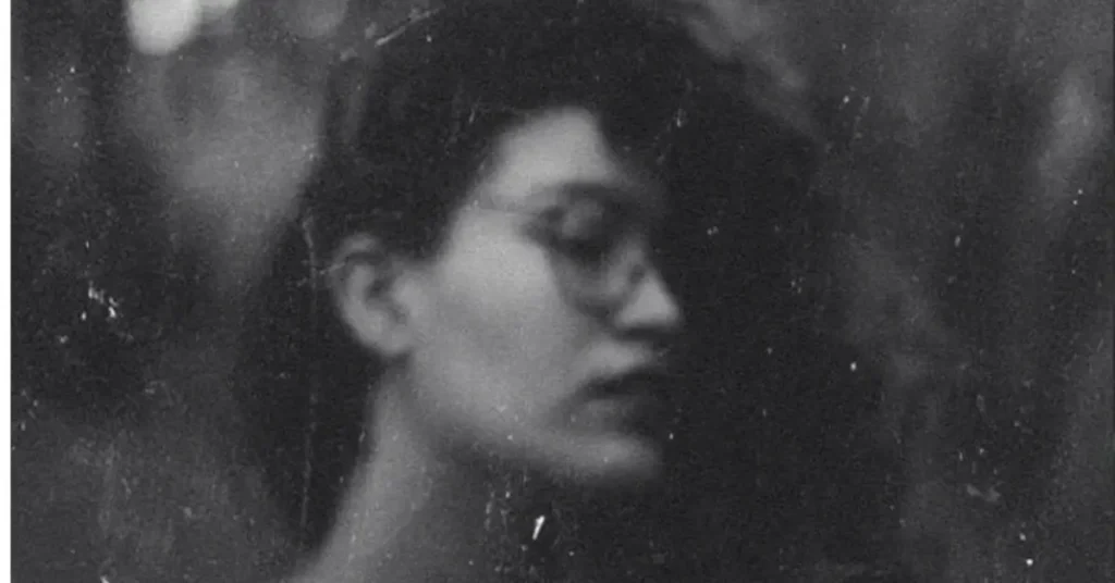 How to Make Photos Look Vintage - Girl with glasses in a photo that was editied with vintage effects