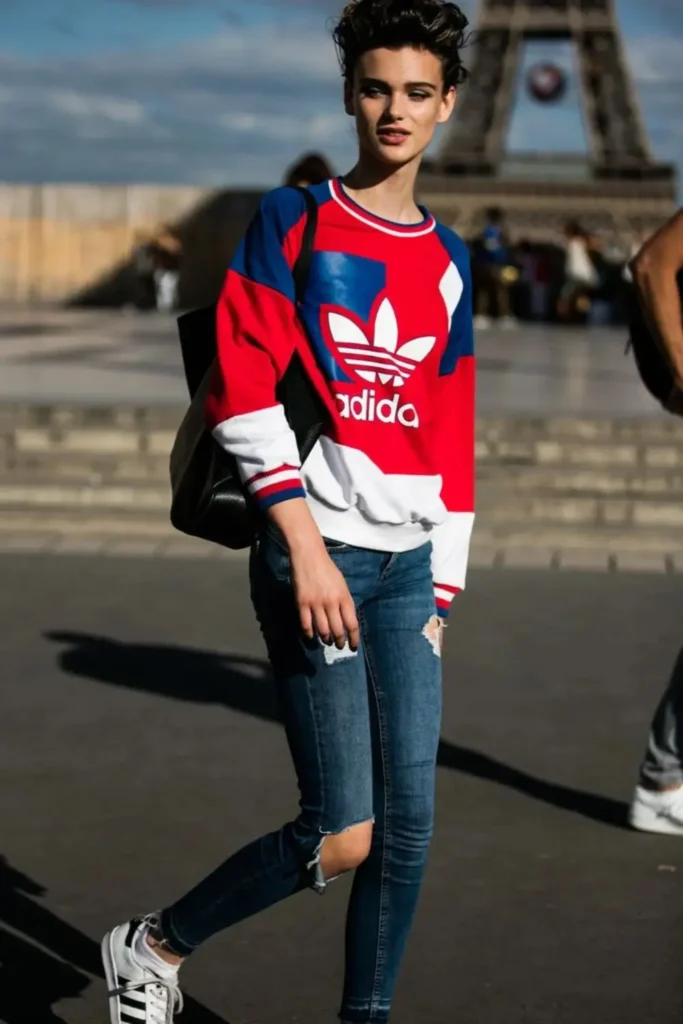 Model in a classic adidas vintage sweatshirt in white, blue and red