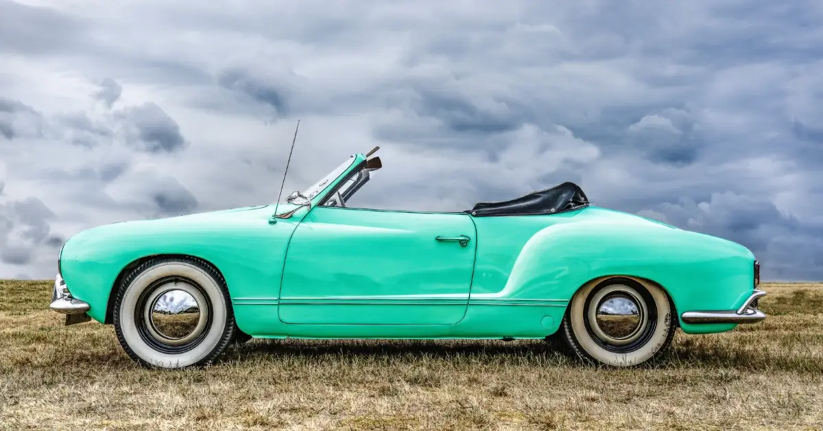 Vintage Convertible Cars - Featured IMage of a light cyan convertible and clouds